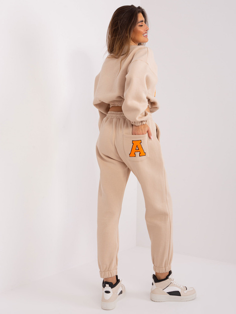 Hurt Beżowo-fluo pomarańczowy komplet dresowy z naszywką