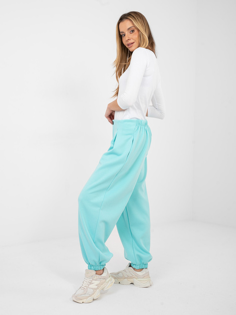 Miętowe dresowe spodnie z zakładkami