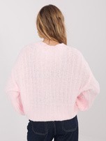 Jasnoróżowy sweter oversize o grubym splocie 