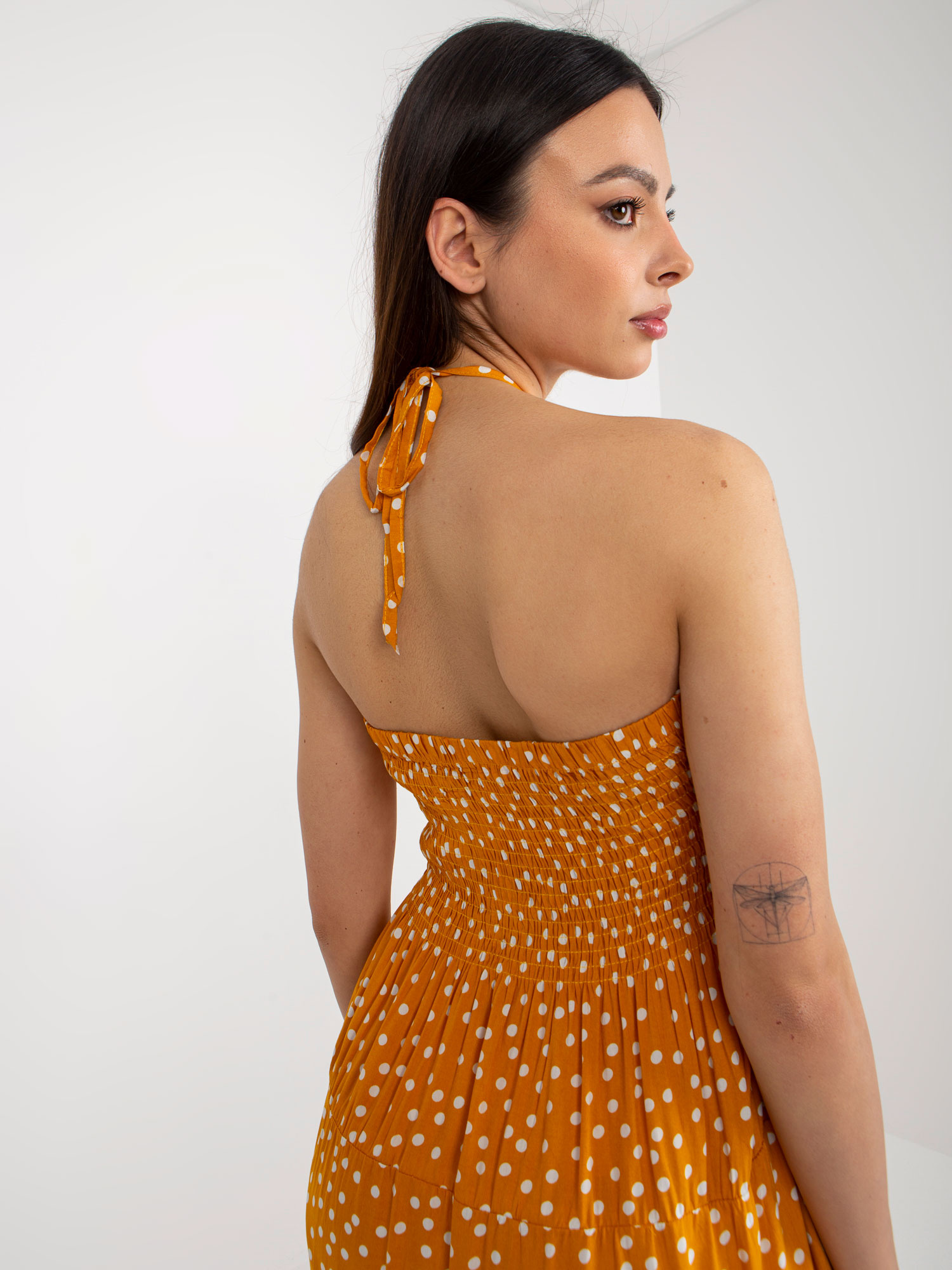 Wholesale Yellow midi dress with polka dots and frill.