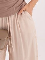 Beżowe damskie spodnie palazzo z wiązaniem