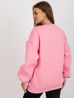 Hurtownia Różowa dresowa bluza bez kaptura z napisem