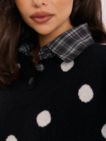 Black women's oversized polka dot sweater.