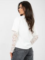 Ecru women's blouse made of soft material.