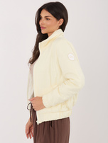 Jasnożółta przejściowa kurtka z pikowaniem