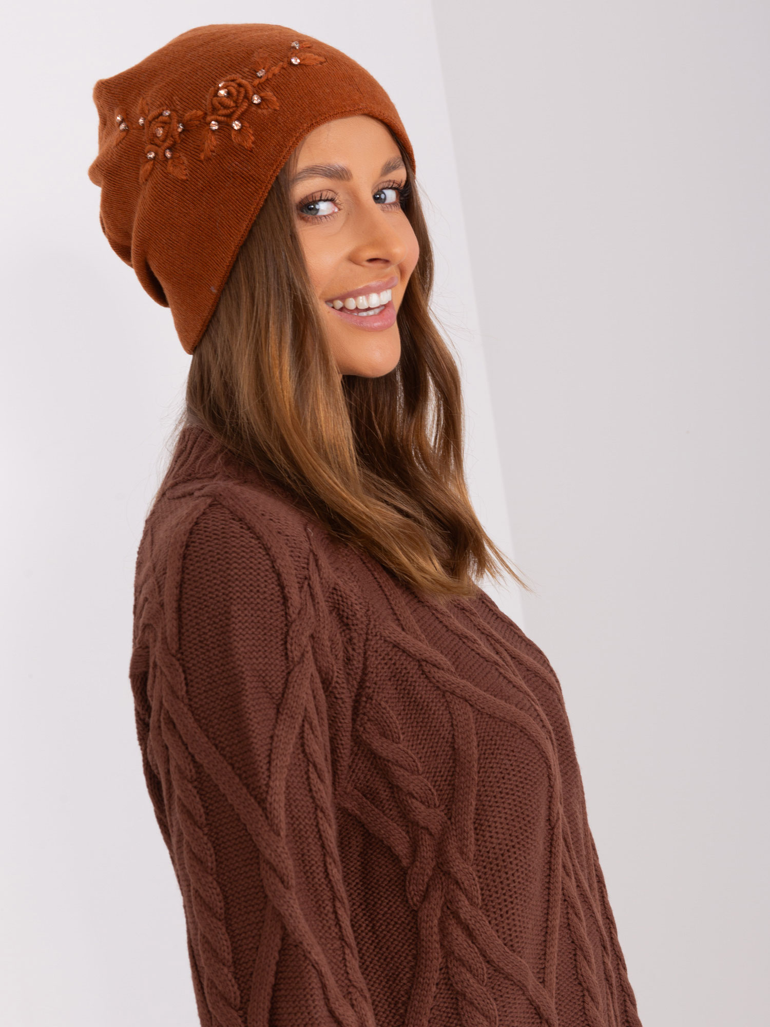 Wholesale light brown women's hat with an application.