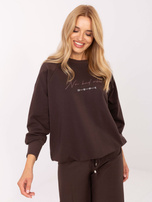 Dark brown cotton blouse with a ribbed cuff.