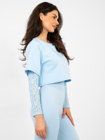 Pastelowe niebieskie body z zapięciem na haftki