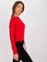 Carla's red blouse.
