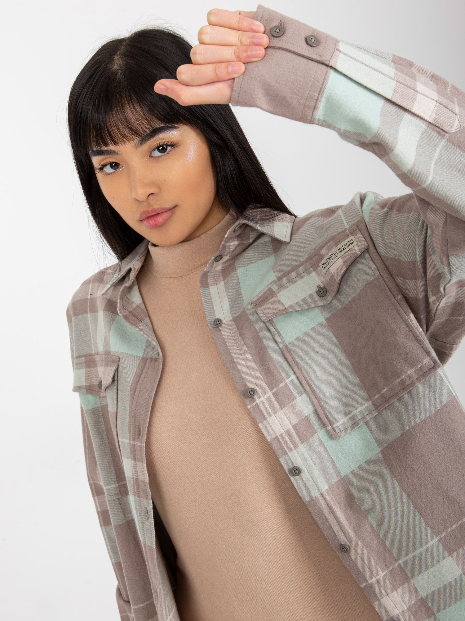 Hurt Dark beige loose checkered shirt with a longer back.