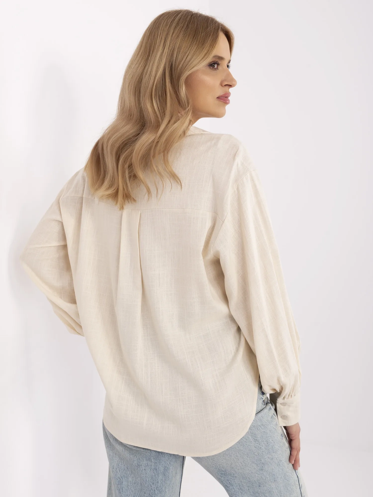 Light beige oversized shirt with puff sleeves.
