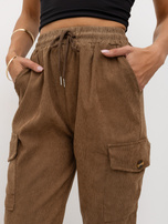 Brown corduroy pants with cuffs at the bottom.