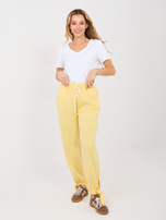 Jasnożółte dresowe spodnie z kieszeniami