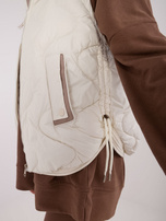 Hurt Ecru down vest with pockets.