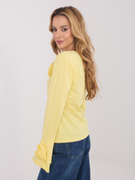 Jasnożółta bluzka z rękawem typu dzwon