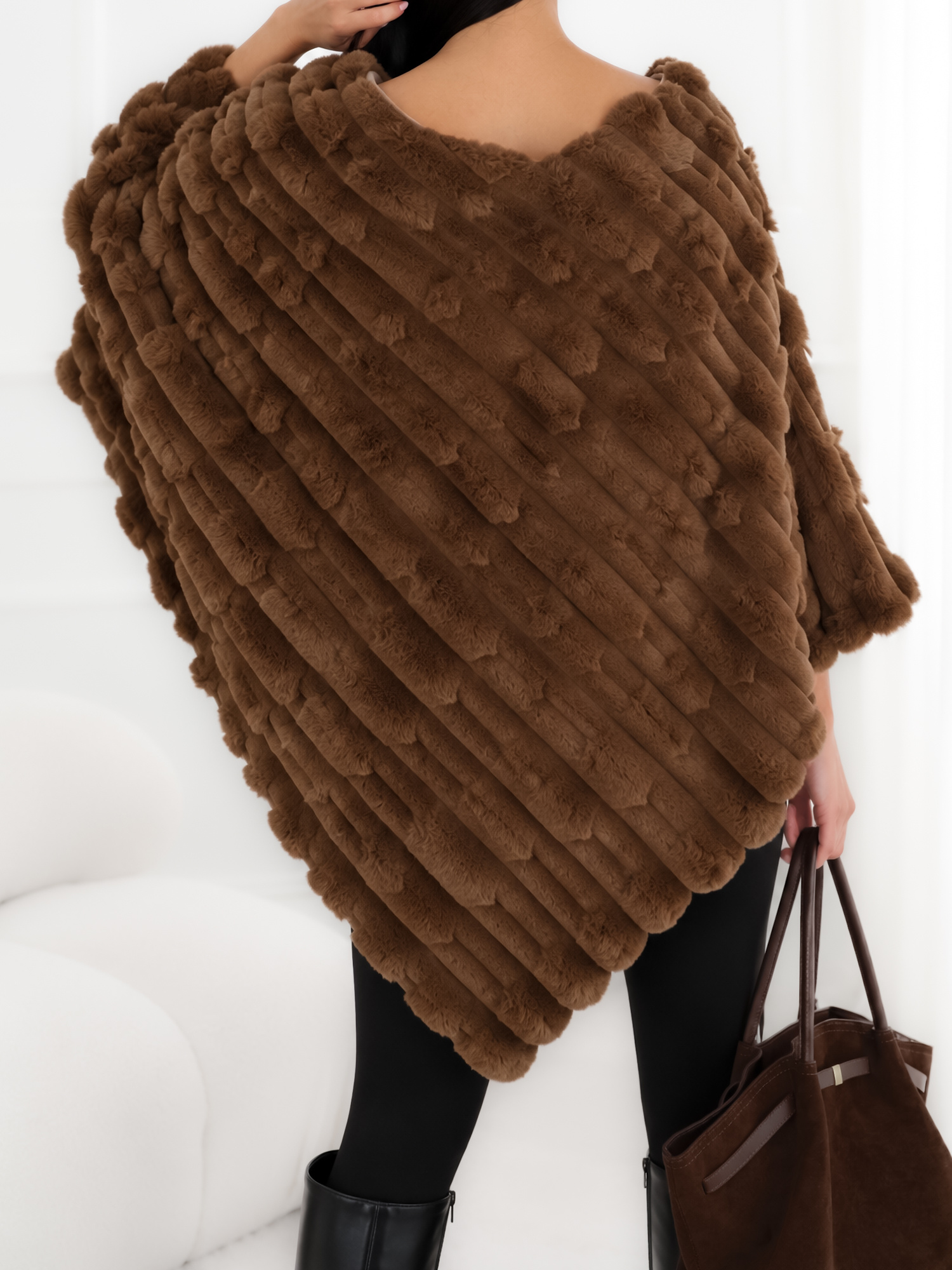 Dark beige women's poncho made of soft synthetic fur.
