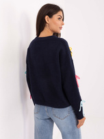 Navy women's sweater with appliqués.