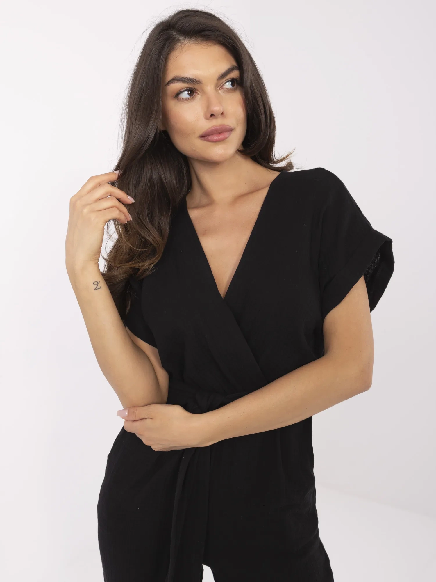 Black muslin jumpsuit with pockets.