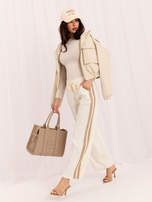 Ecru corduroy pants with stripes.
