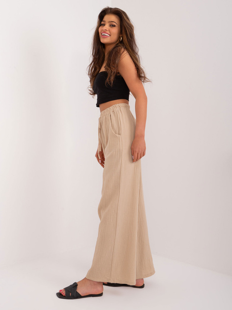 Hurt Beżowe zwiewne spodnie materiałowe z wiązaniem