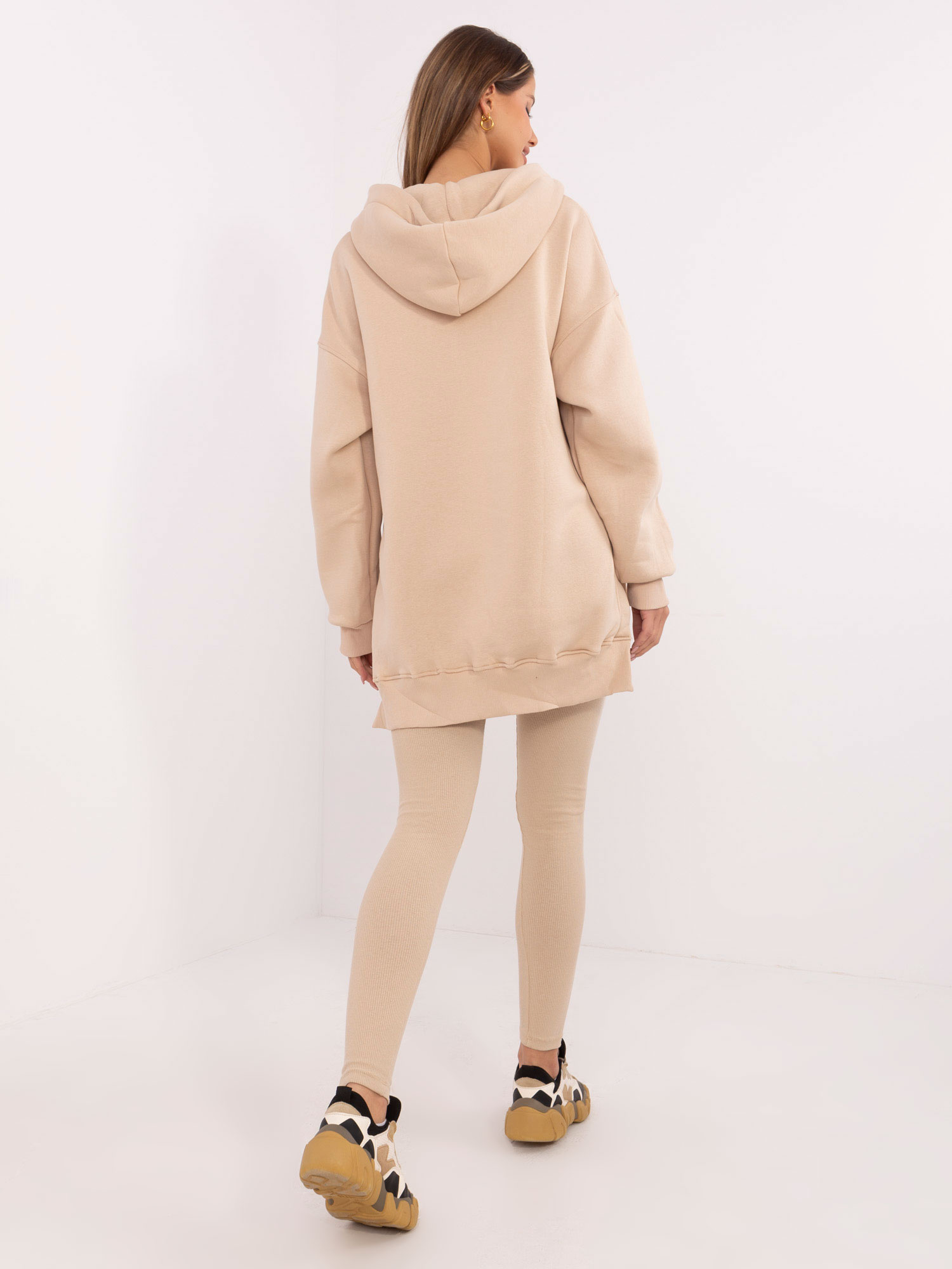Beige three-piece set with a warm hoodie.
