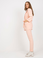 Peach Hurt elegant set with a tied belt.