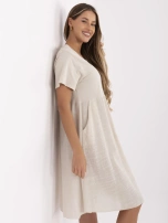 Beige summer dress with short sleeves.
