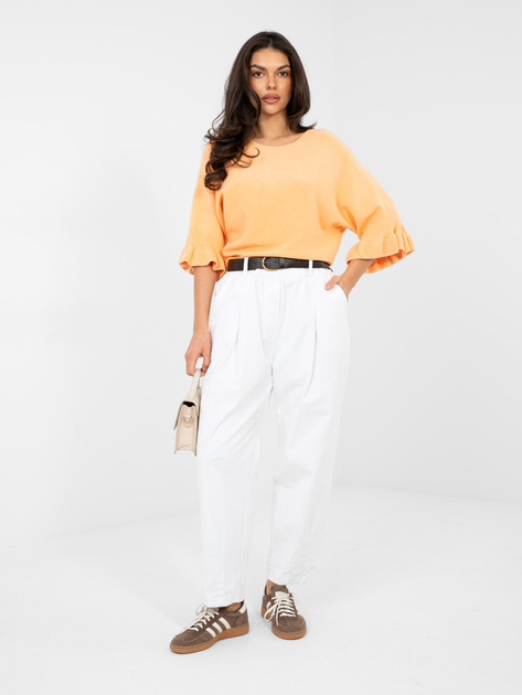 Pastelowy pomarańczowy sweter z jednolitym kolorze