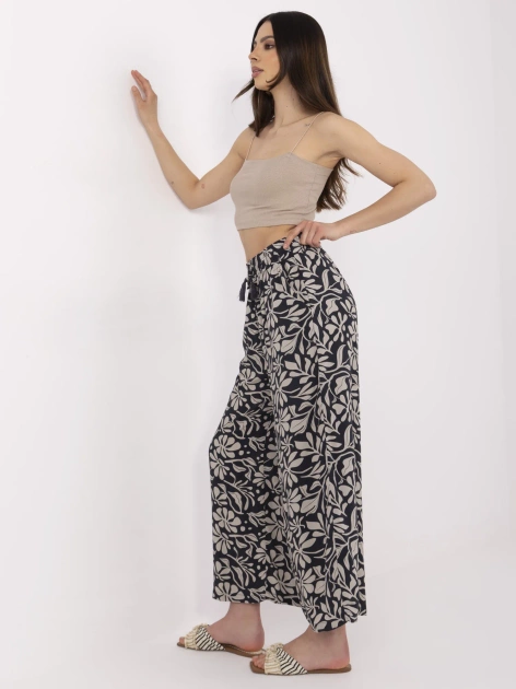 Granatowe spodnie z roślinnym motywem SUBLEVEL