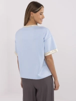 Light blue women's oversized blouse with viscose.