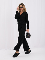 Black two-piece set made of ribbed knit.
