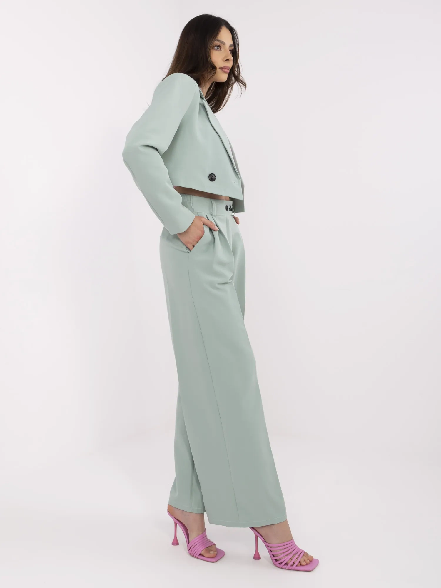 Pistachio suit with pleats on the pants.