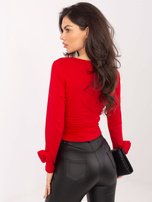 Czerwona krótka bluzka z długim rękawem