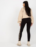 Hurt Czarne legginsy casualowe z napisami po bokach 