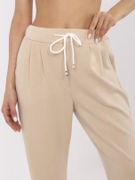 Jasnobeżowe dresowe spodnie basic z kieszeniami 