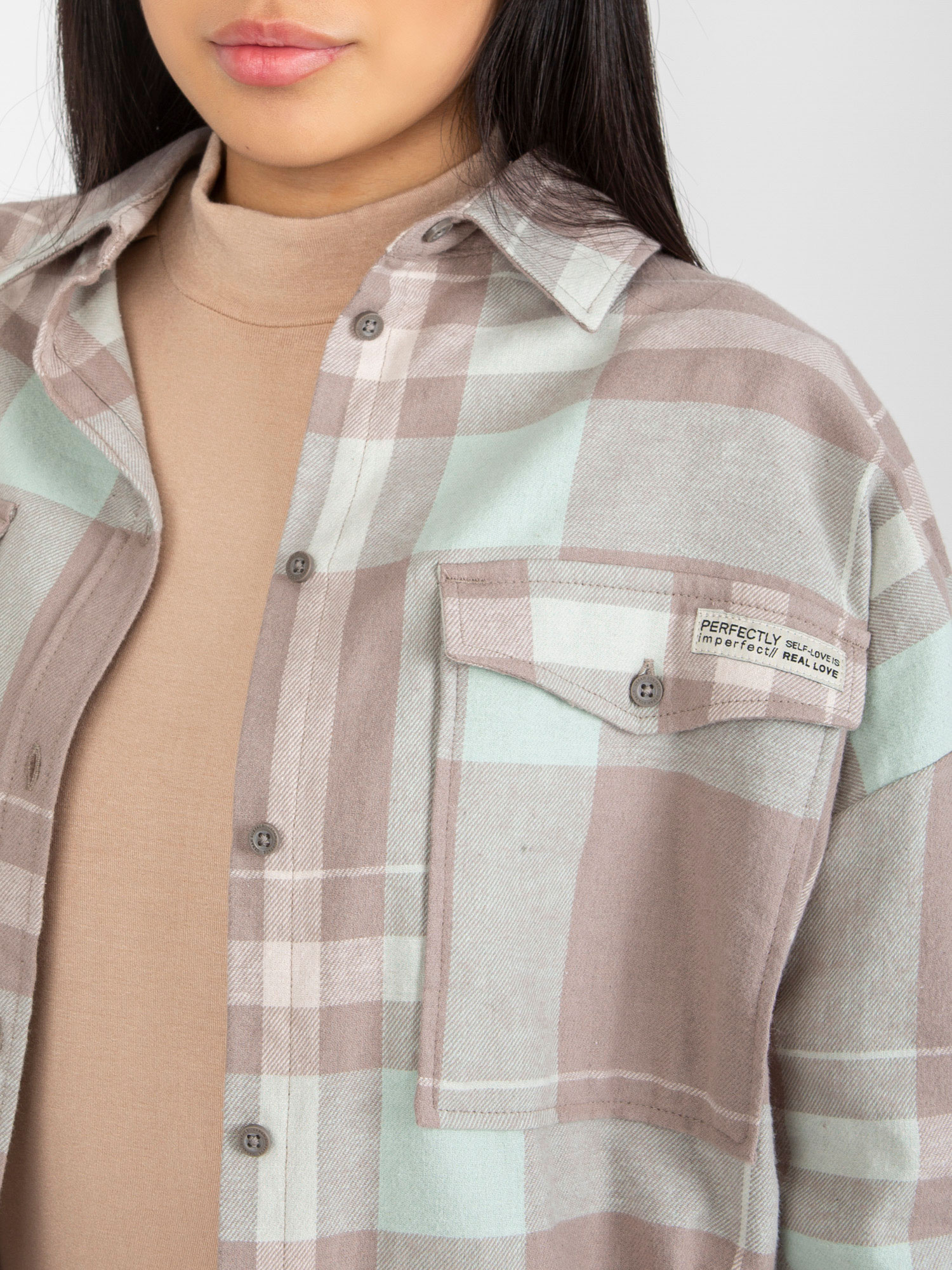 Hurt Dark beige loose checkered shirt with a longer back.