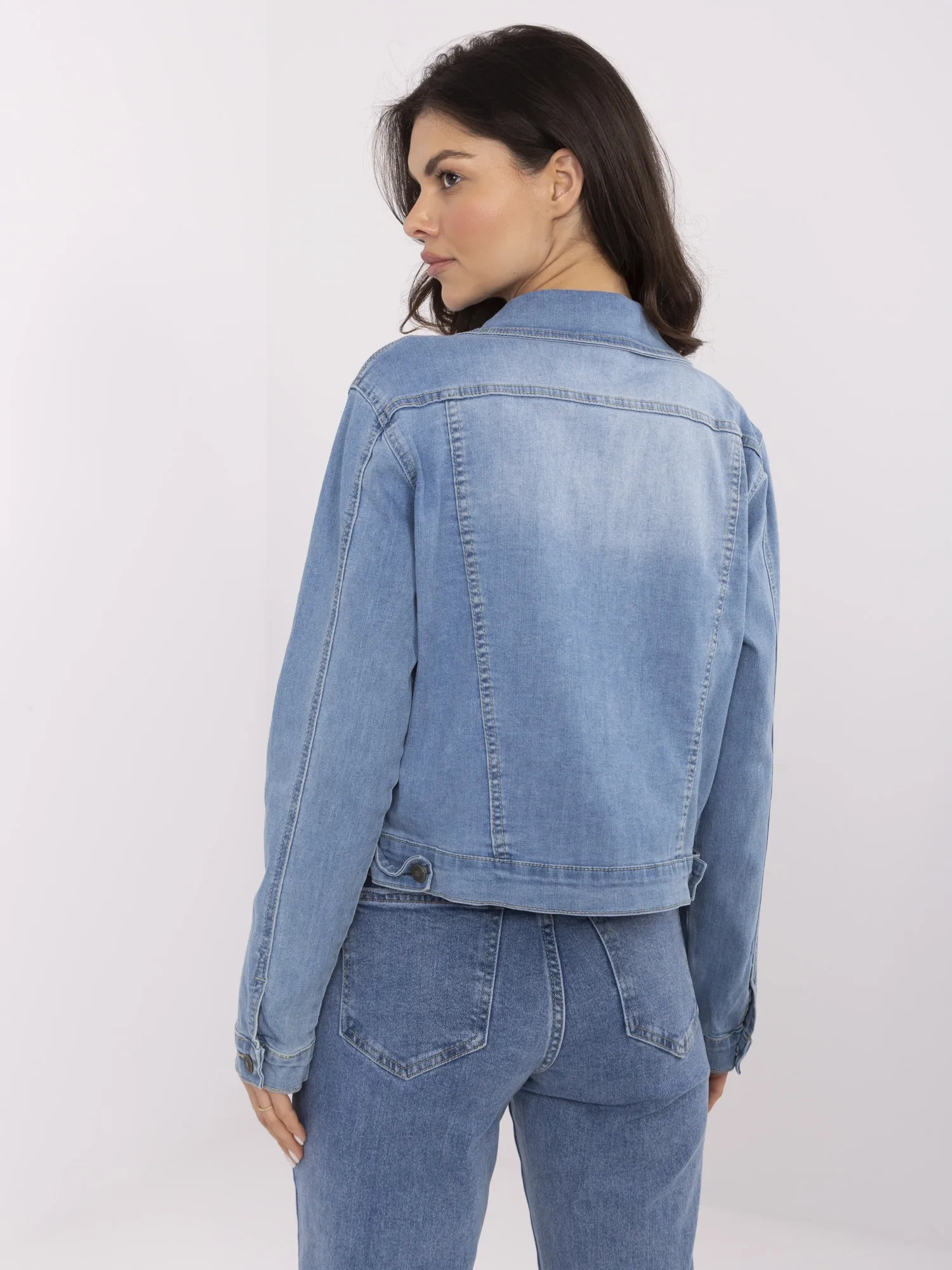 Blue short denim jacket with pockets.
