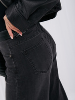 Black women's high-waisted mom jeans.
