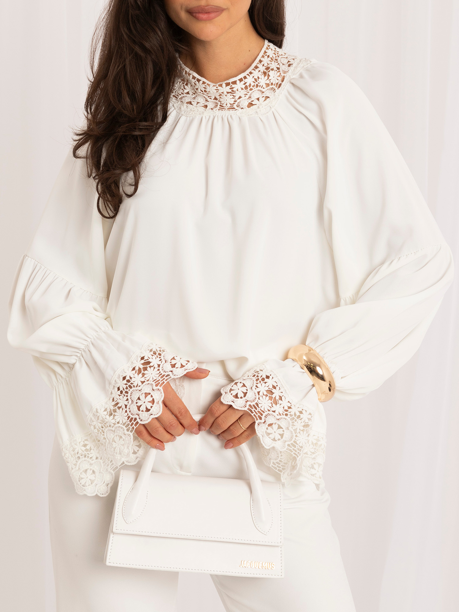 Ecru elegant blouse with lace trim.