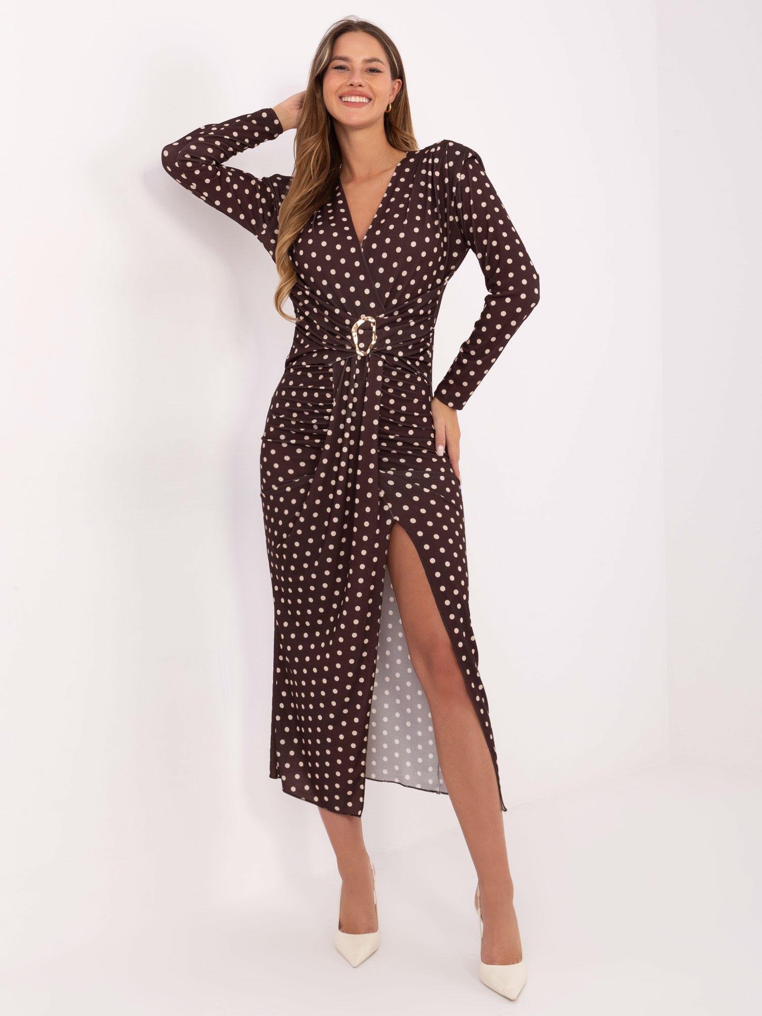 Dark brown draped dress with polka dots.