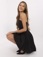 Black cocktail dress with pleats.