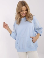 Light blue hoodie with embroidery on the sleeves.