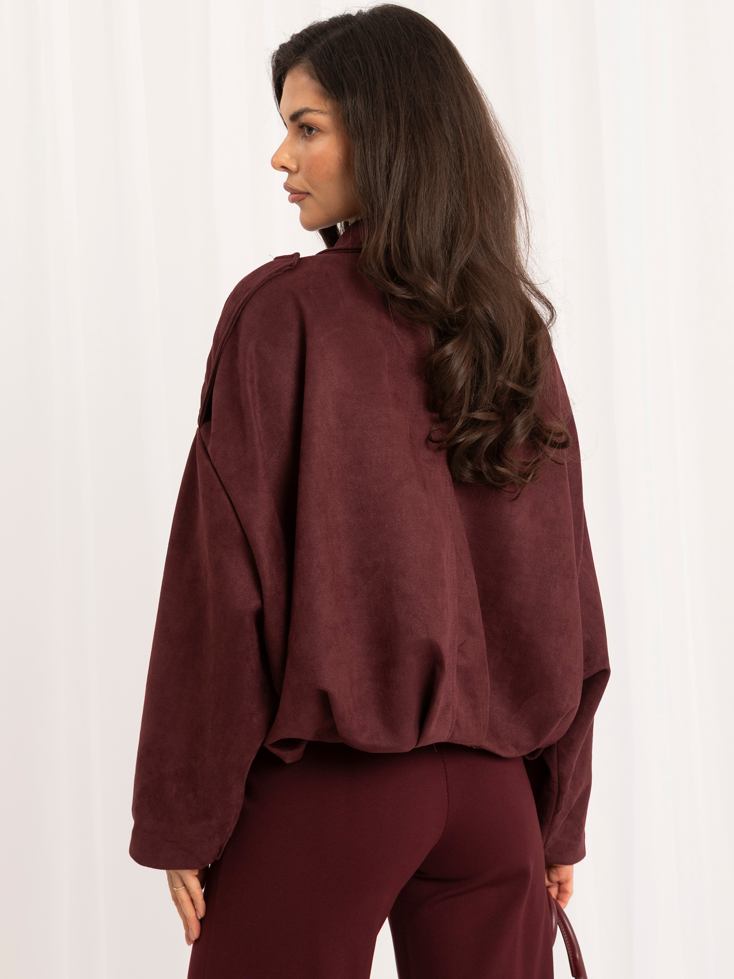 Burgundy women's bomber jacket made of faux suede.