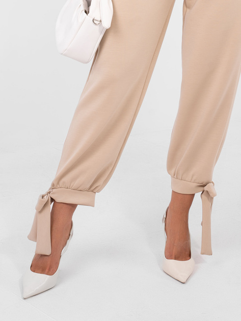 Beżowe dresowe spodnie ze ściągaczami