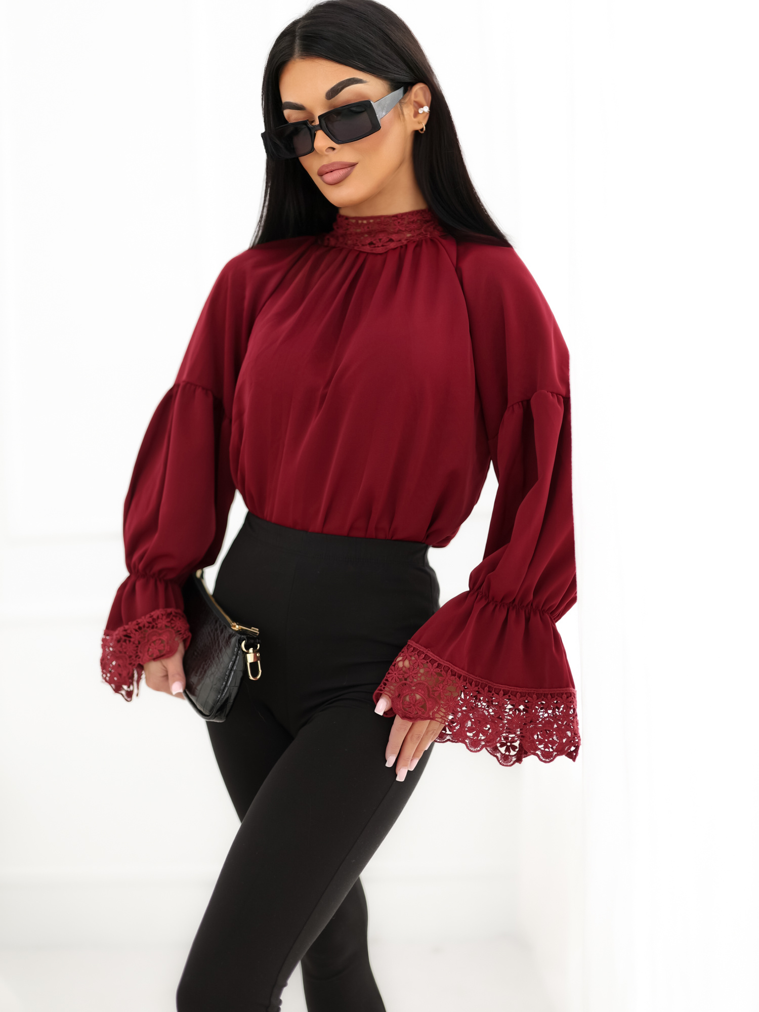 Burgundy blouse with a neck tie.