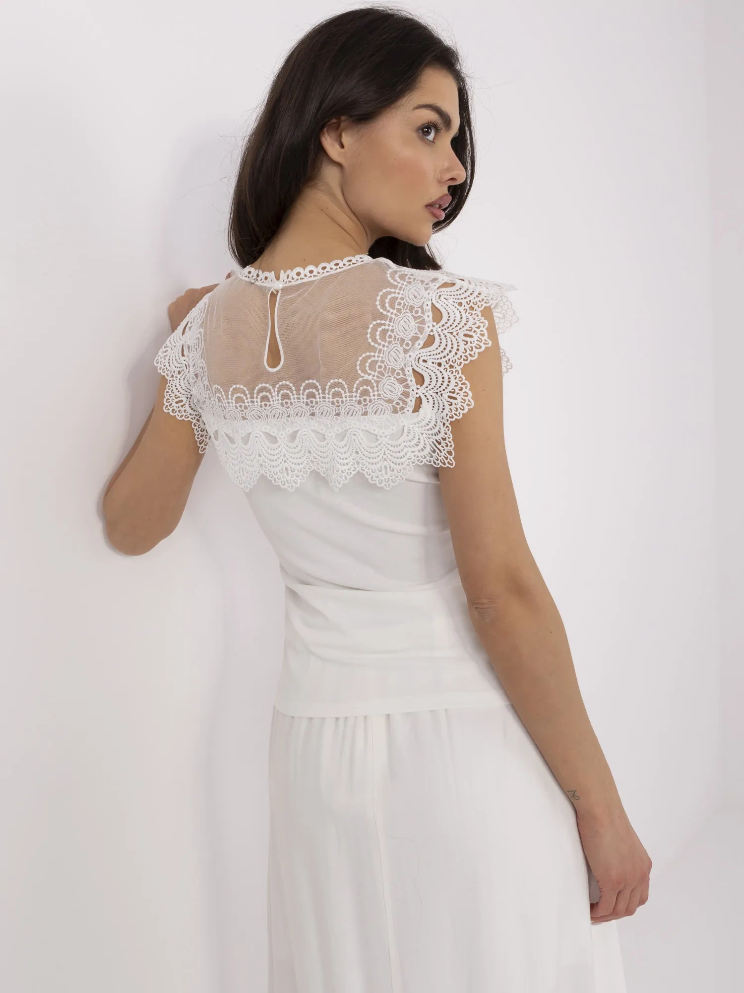 White fitted blouse with lace.