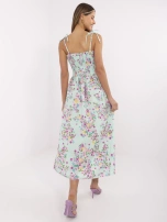 Mint long dress with tied straps.