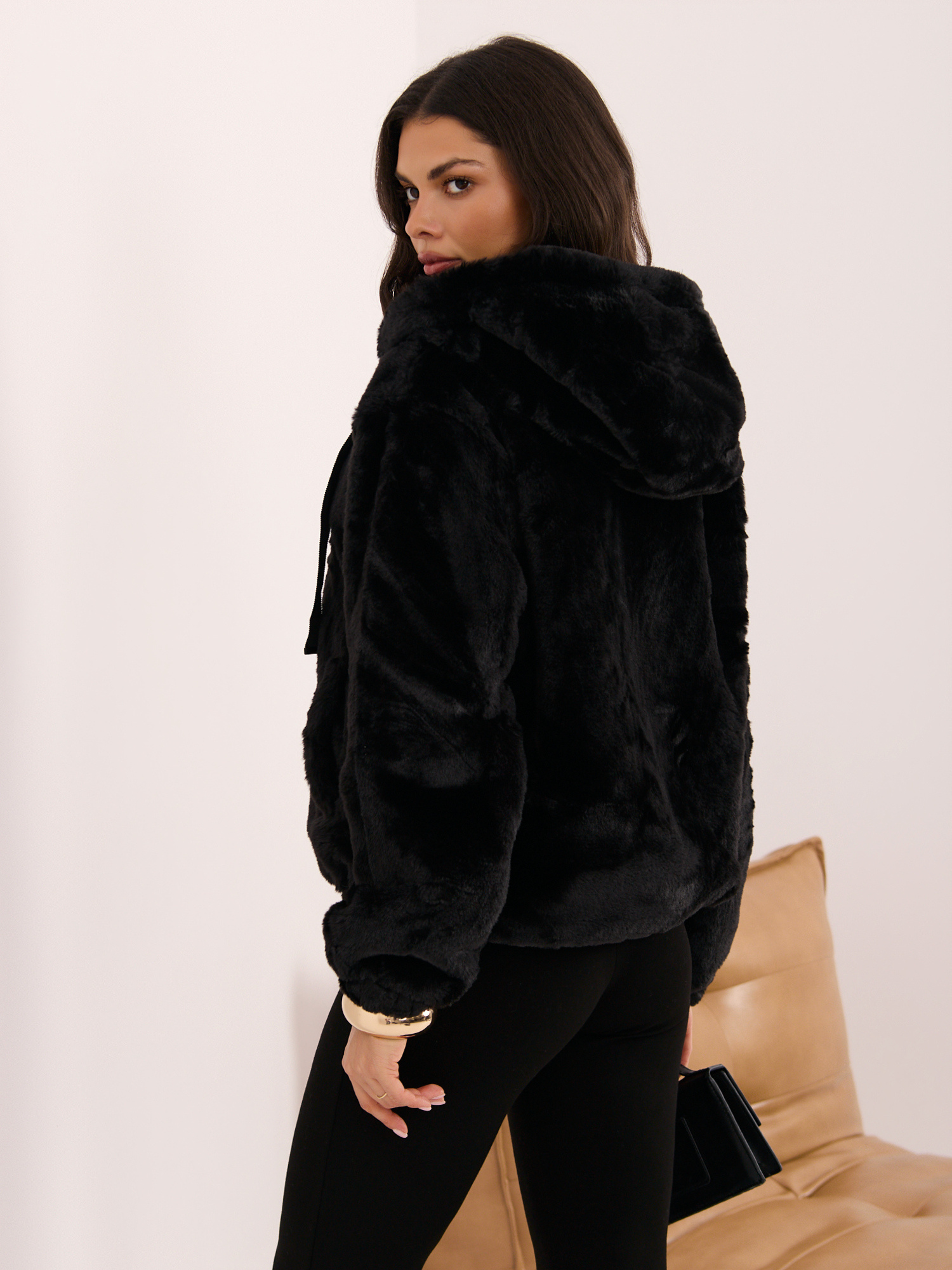Black fur jacket with a hood.