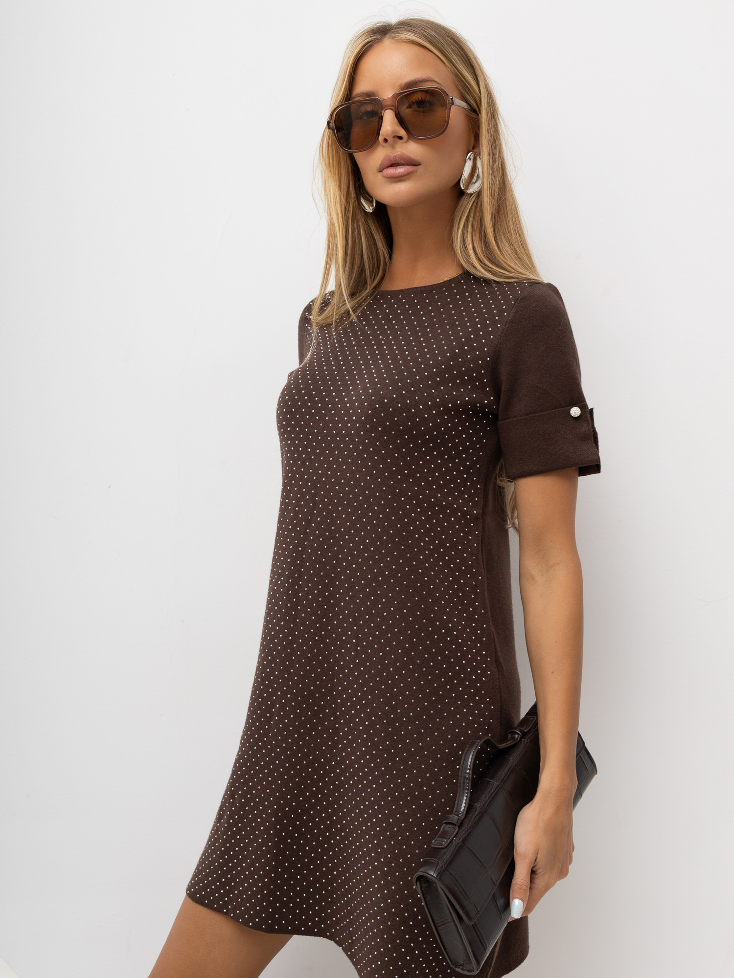 Brown trapeze dress with studs.