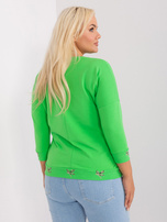 Hurtownia Jasnozielona damska bluzka plus size ze ściągaczem